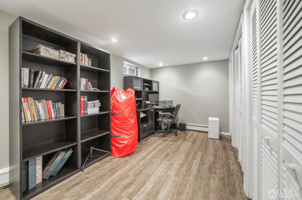 19 Mary Ellen Drive Edison, NJ 08820 - Photo 25 of 36 a room with furniture a rug and a book shelf