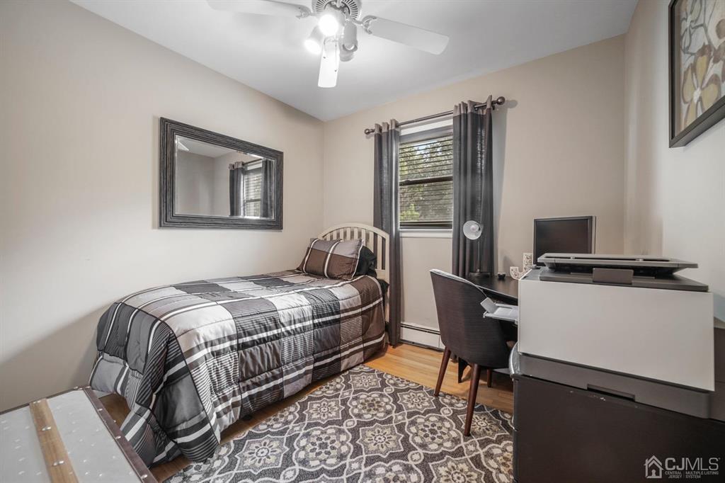 19 Mary Ellen Drive Edison, NJ 08820 - Photo 30 of 36 a bedroom with a bed and a window