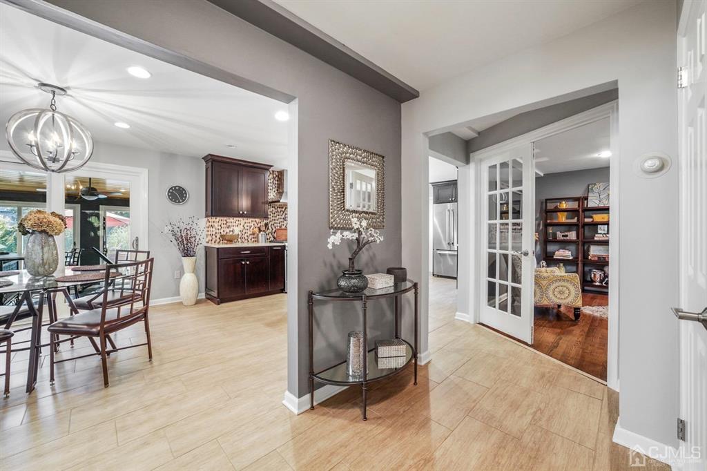 19 Mary Ellen Drive Edison, NJ 08820 - Photo 5 of 36 a view of a livingroom with furniture and a kitchen