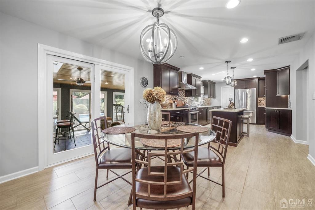 19 Mary Ellen Drive Edison, NJ 08820 - Photo 9 of 36 a view of a dining room with furniture window and wooden floor