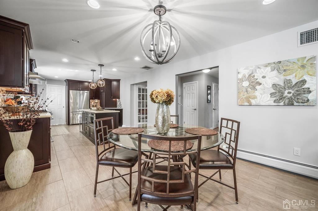 19 Mary Ellen Drive Edison, NJ 08820 - Photo 10 of 36 a view of a dining room with furniture and wooden floor