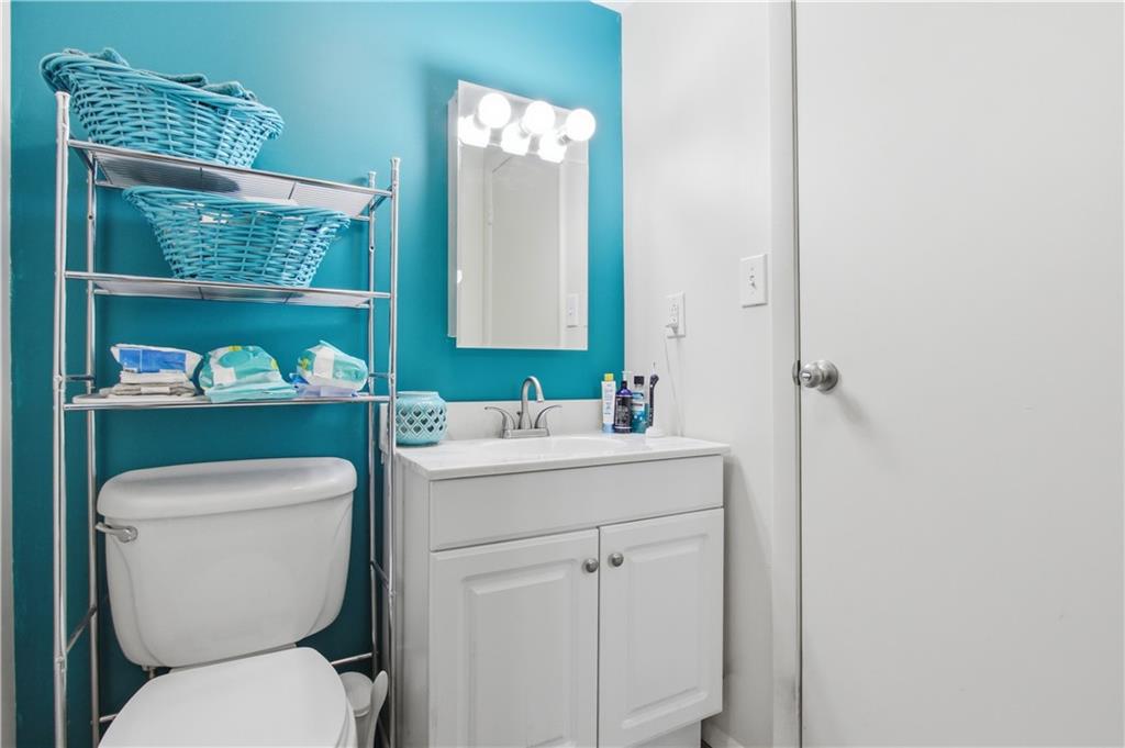 776 Fraction Road West Finley, PA 15377 - Photo 25 of 43 a bathroom with a toilet a sink and a mirror