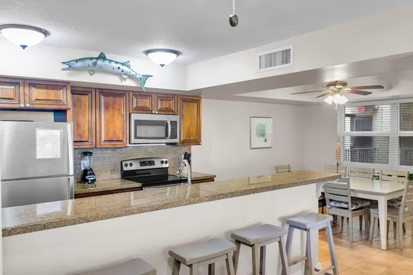 a kitchen with a counter space a sink and appliances