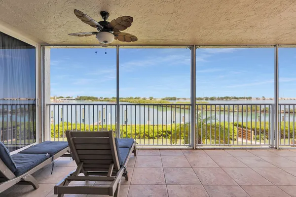 a view of a balcony with furniture