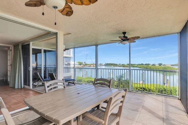 a patio with a table and chairs