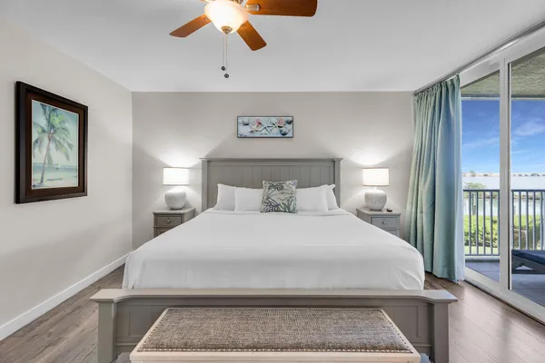a bedroom with a large bed and a window