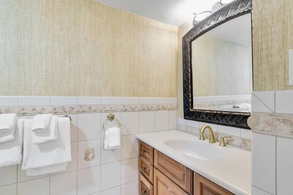 a bathroom with a sink and a mirror