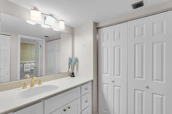 a bathroom with a double vanity sink and a mirror