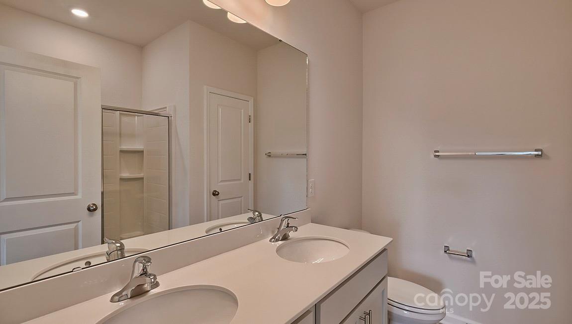 49 Shorthorn Road Fletcher, NC 28732 - Photo 15 of 19 a bathroom with a sink and a mirror