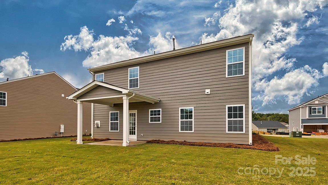 49 Shorthorn Road Fletcher, NC 28732 - Photo 18 of 19 a front view of a house with a garden