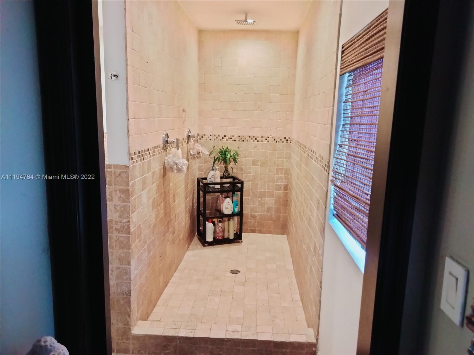 8251 Southwest 34th Terrace Miami, FL 33155 - Photo 13 of 24 a view of a hallway with wooden floor and windows