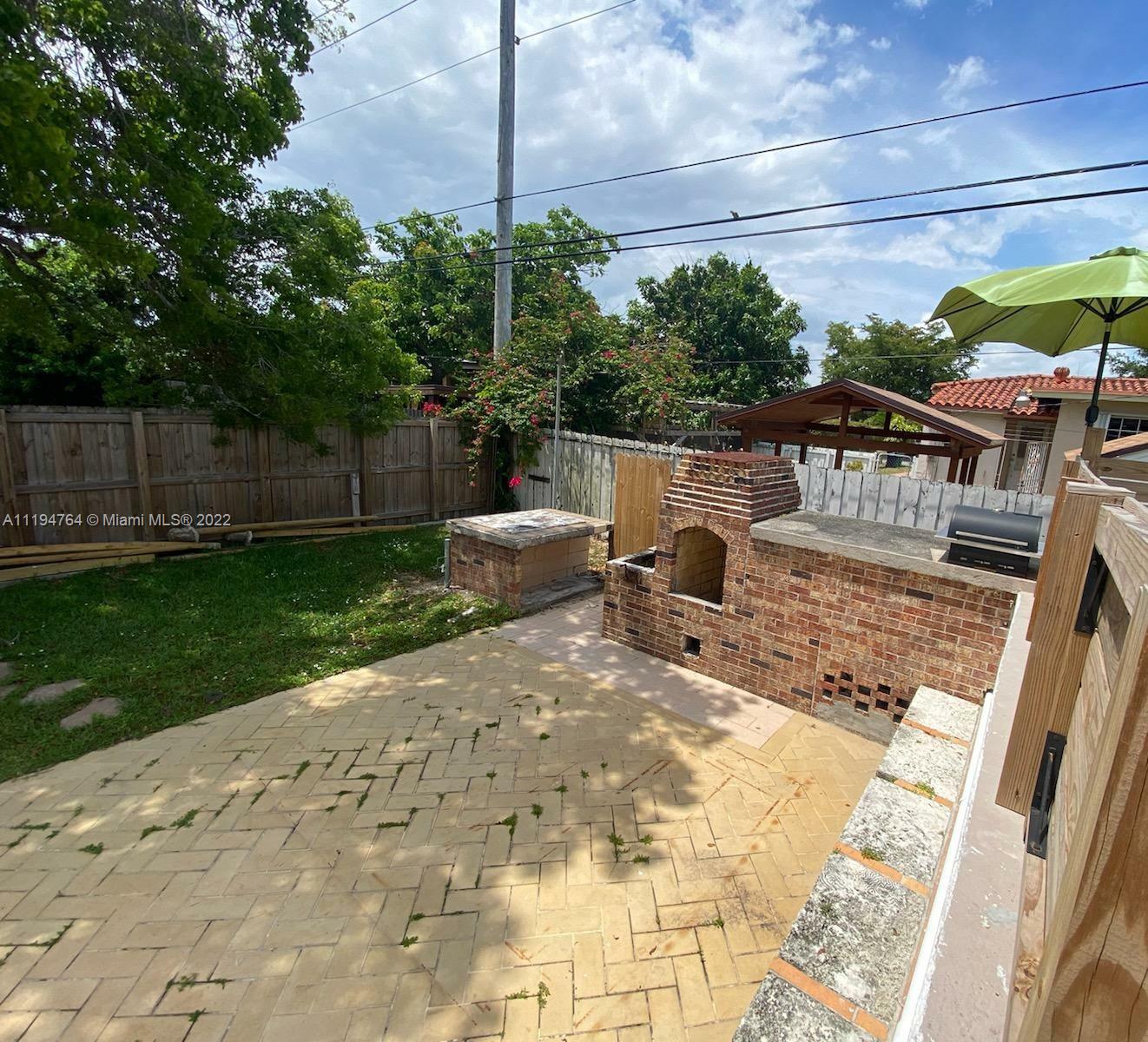8251 Southwest 34th Terrace Miami, FL 33155 - Photo 17 of 24 a view of a backyard with sitting area