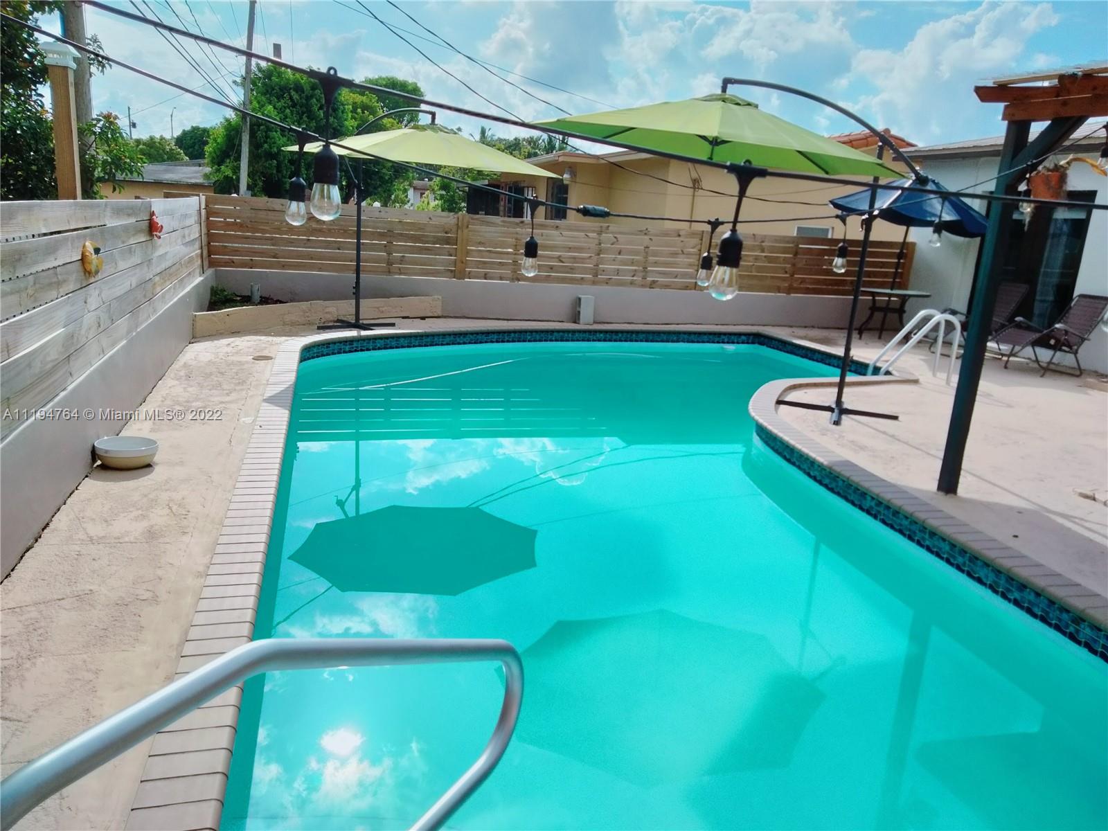 8251 Southwest 34th Terrace Miami, FL 33155 - Photo 20 of 24 a view of a backyard with sitting area