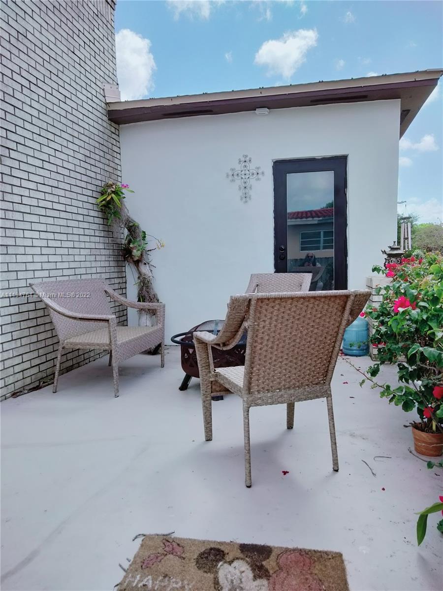 8251 Southwest 34th Terrace Miami, FL 33155 - Photo 2 of 24 a outdoor space with a couch and a potted plant
