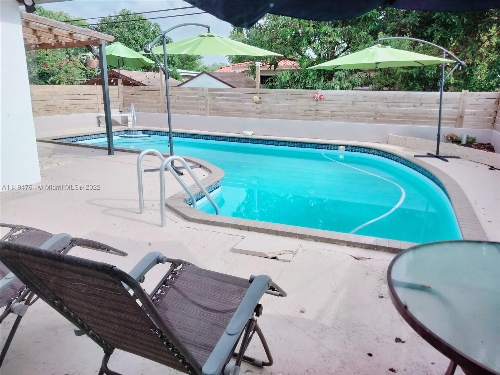 8251 Southwest 34th Terrace Miami, FL 33155 - Photo 21 of 24 a view of a chairs and table in the patio