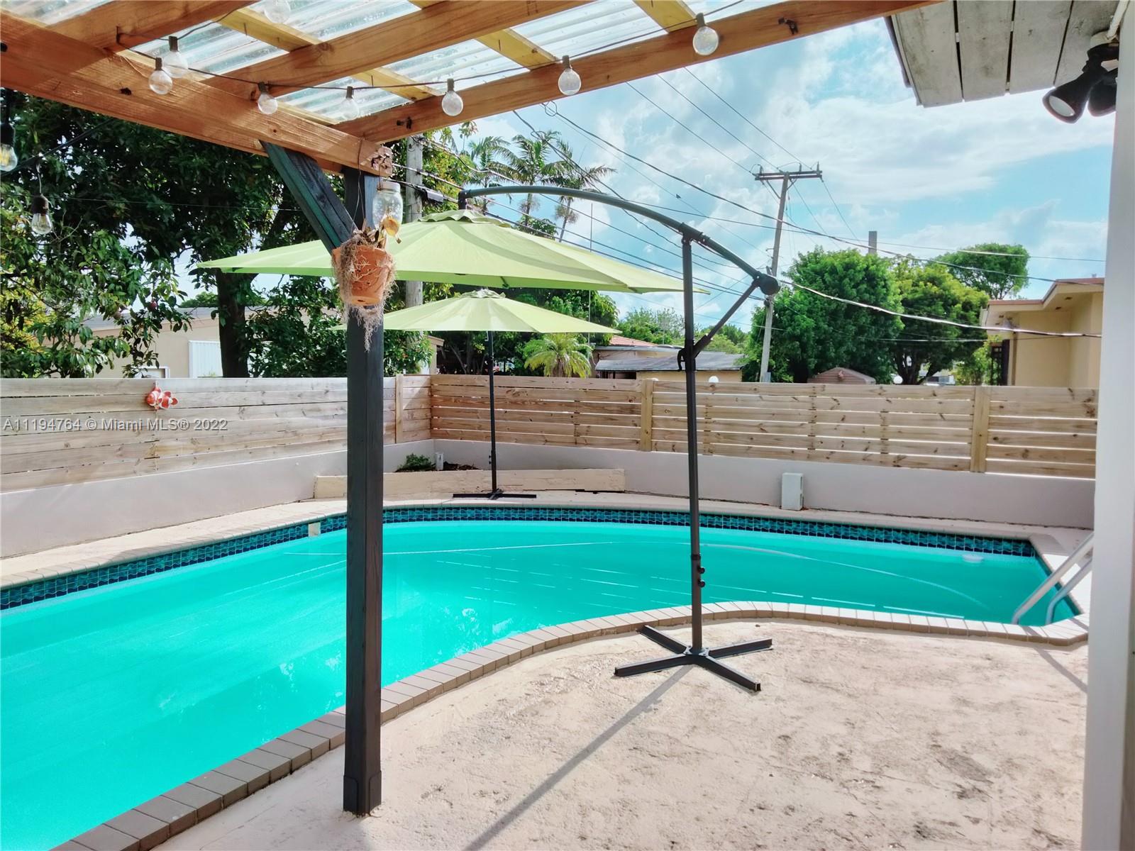 8251 Southwest 34th Terrace Miami, FL 33155 - Photo 23 of 24 a house view with a garden space