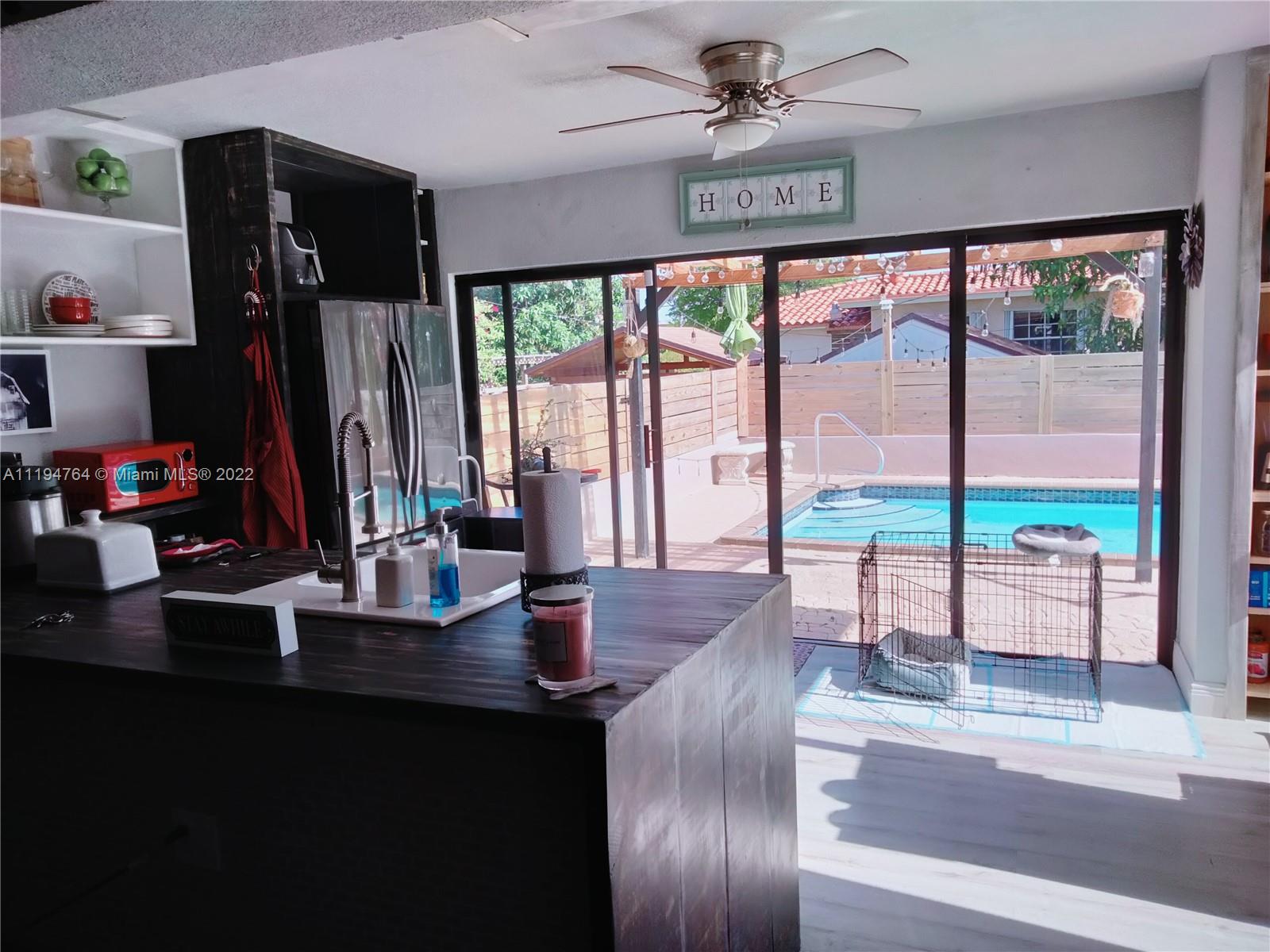 8251 Southwest 34th Terrace Miami, FL 33155 - Photo 3 of 24 a view of a dining room with furniture window and outside view