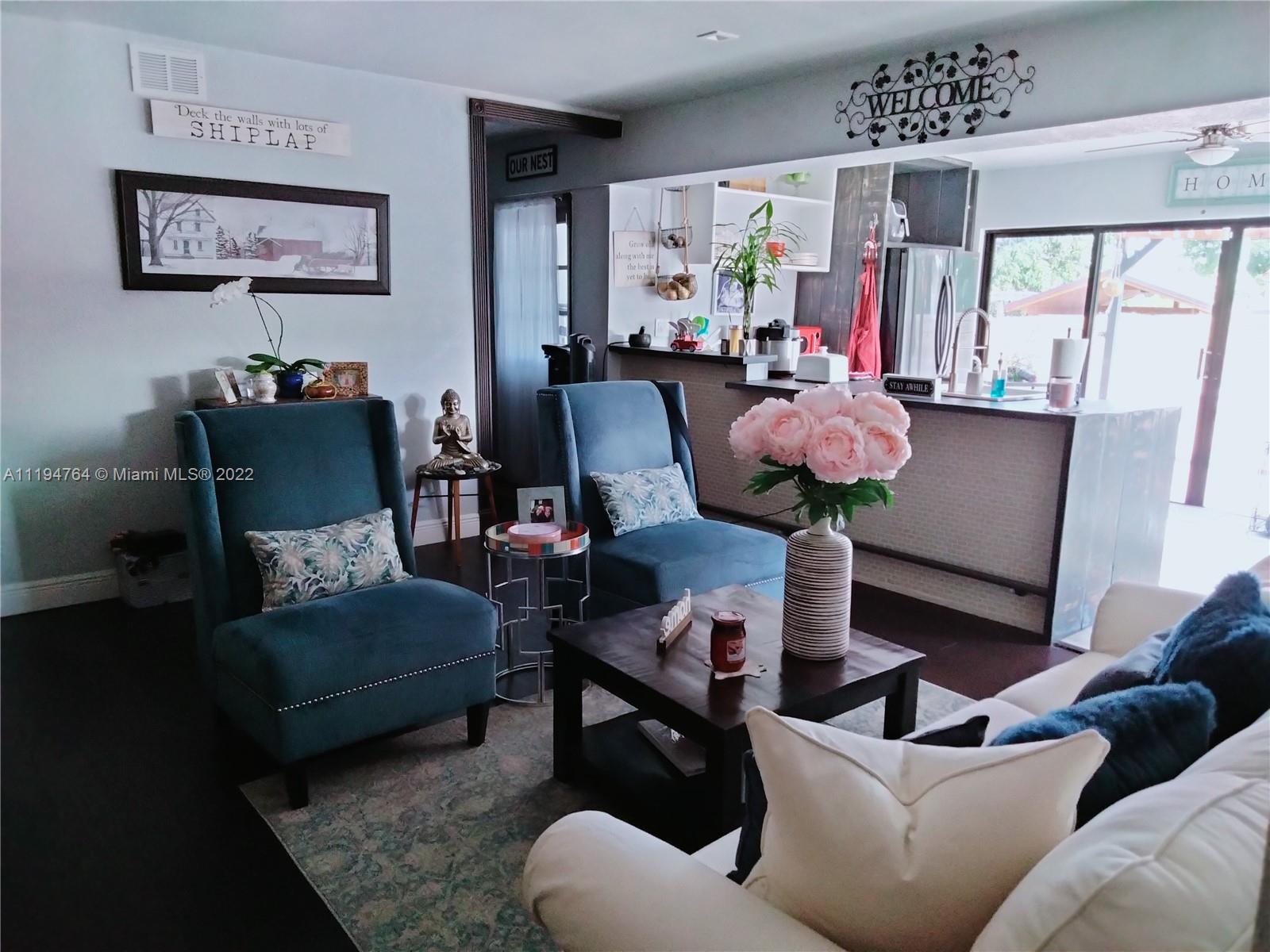 8251 Southwest 34th Terrace Miami, FL 33155 - Photo 7 of 24 a living room with furniture and a large mirror