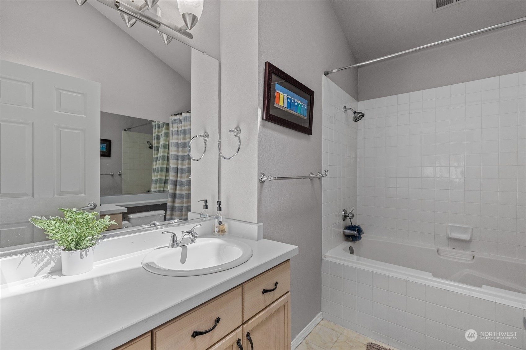 22727 4th Avenue West, Unit 106 Bothell, WA 98021 - Photo 20 of 35 a bathroom with a sink a tub and a mirror