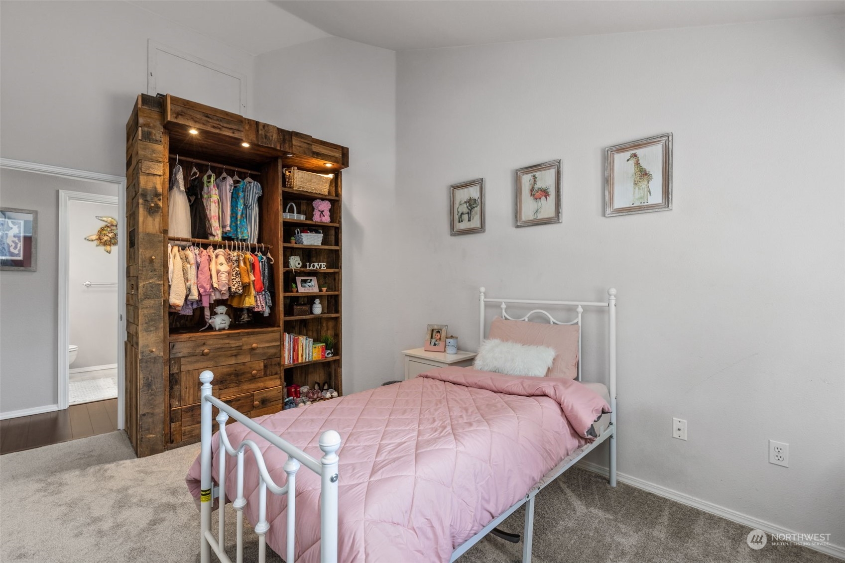 22727 4th Avenue West, Unit 106 Bothell, WA 98021 - Photo 23 of 35 a bedroom with a bed and wooden floor