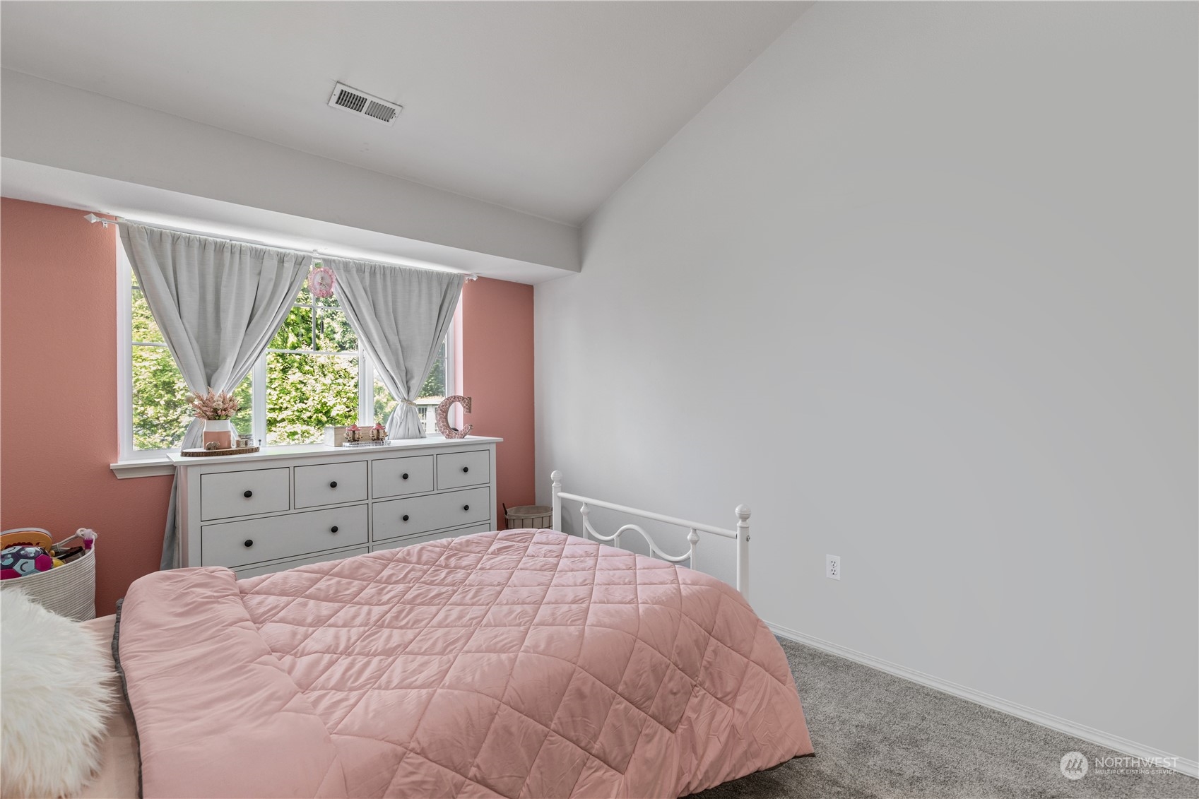 22727 4th Avenue West, Unit 106 Bothell, WA 98021 - Photo 25 of 35 a bedroom with a bed and a window