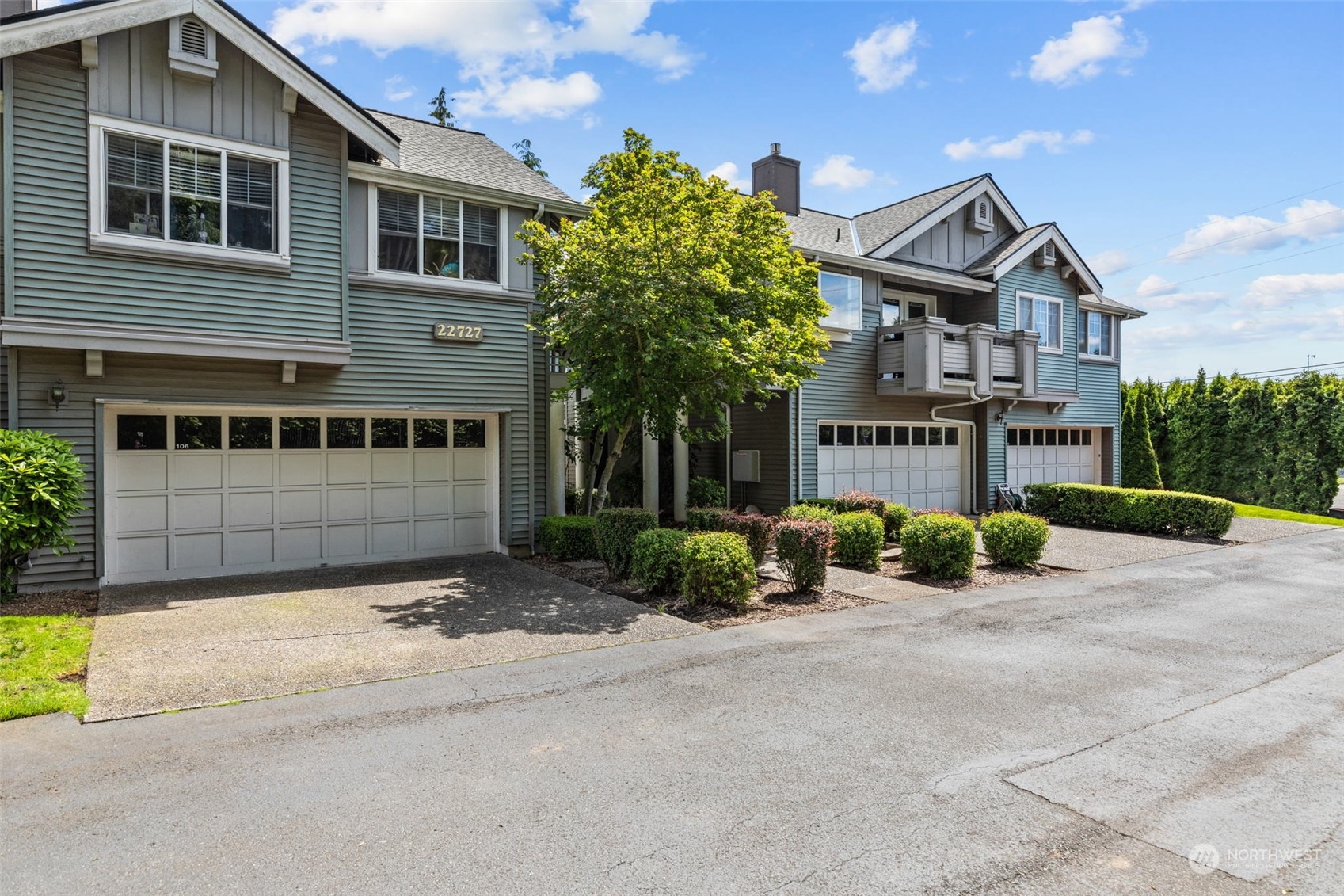 22727 4th Avenue West, Unit 106 Bothell, WA 98021 - Photo 34 of 35 a view of a house with a yard and potted plants