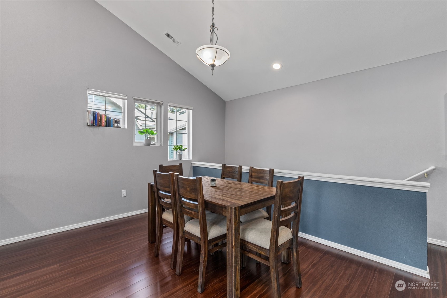 22727 4th Avenue West, Unit 106 Bothell, WA 98021 - Photo 8 of 35 a view of a dining room with furniture and wooden floor