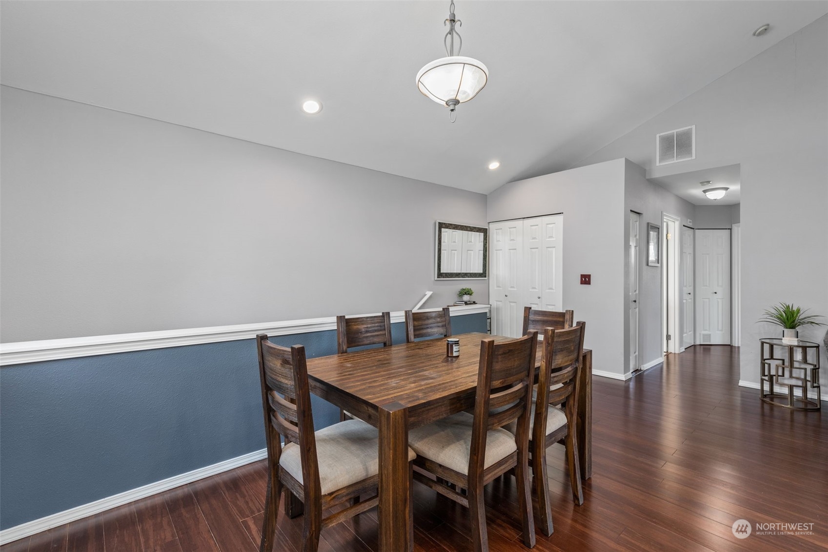 22727 4th Avenue West, Unit 106 Bothell, WA 98021 - Photo 9 of 35 a view of a dining room with furniture wooden floor and chandelier