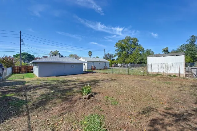a house view with a backyard space