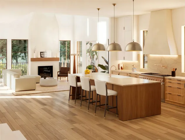 a living room with furniture a fireplace and a dining table with wooden floor