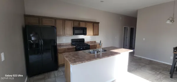 a white toilet sitting next to a white cabinet
