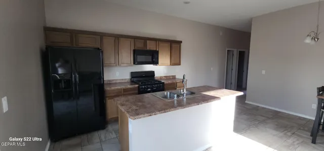 a white toilet sitting next to a white cabinet