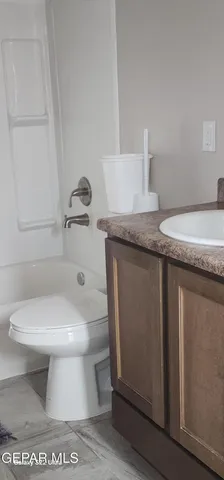 a view of an empty room and a window