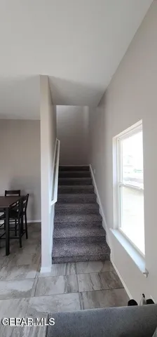 a bathroom with a granite countertop sink a toilet and bathtub