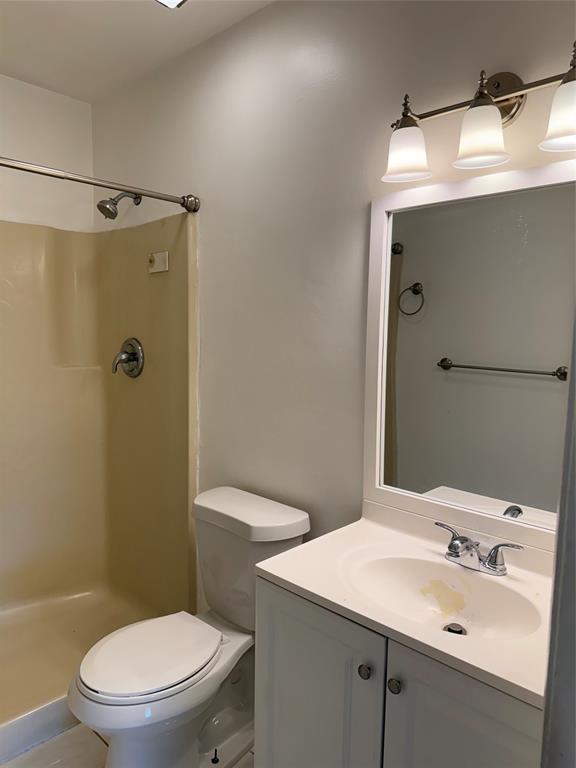 6040 Shaker Wood Circle, Unit 205 Tamarac, FL 33319 - Photo 11 of 14 a bathroom with a sink a toilet and shower
