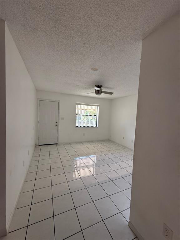 6040 Shaker Wood Circle, Unit 205 Tamarac, FL 33319 - Photo 2 of 14 a view of an empty room and window