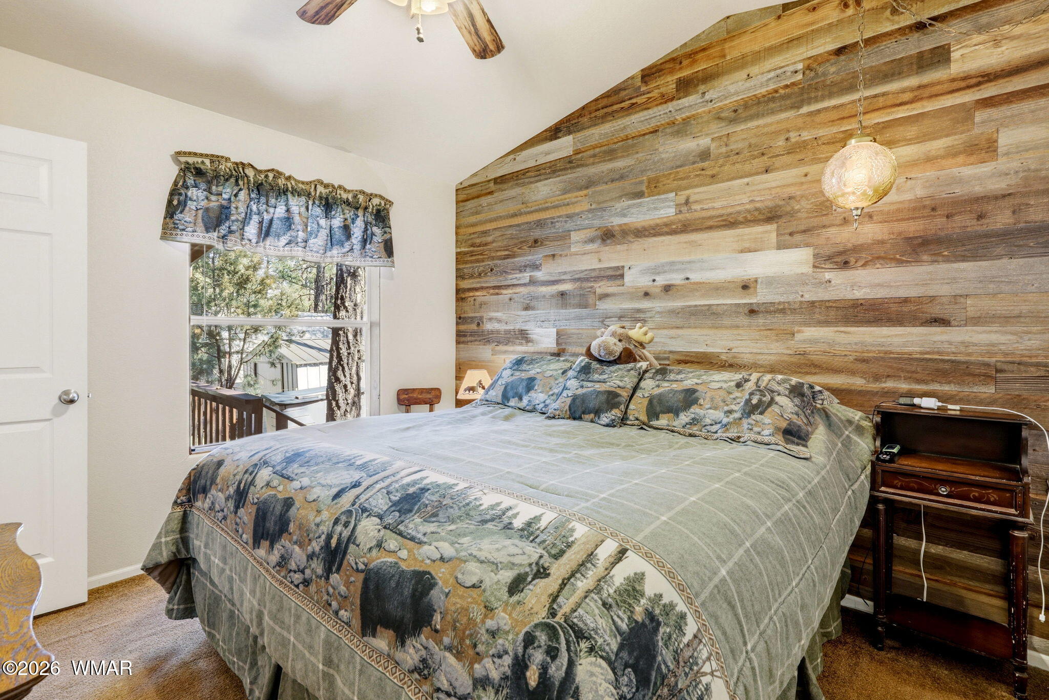 2893 Tracy Road Overgaard, AZ 85933 - Photo 13 of 26 a bedroom with a bed and a window