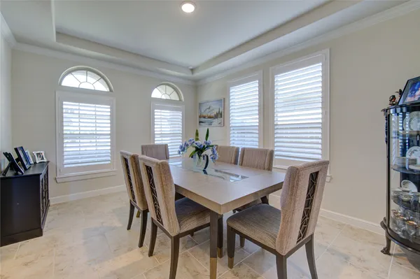 a view of a dining room with furniture and a fireplace