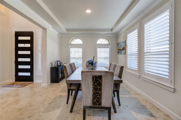 a kitchen with stainless steel appliances granite countertop a stove and white cabinets