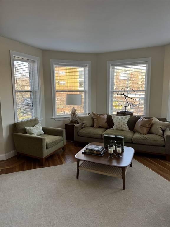 3 Alton Place, Unit 2 Brookline, MA 02446 - Photo 1 of 42 a living room with furniture and a large window