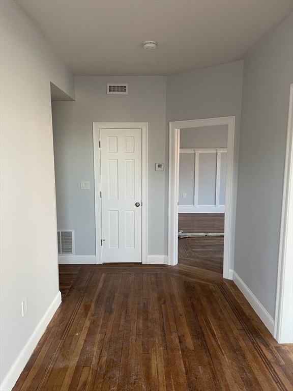 3 Alton Place, Unit 2 Brookline, MA 02446 - Photo 11 of 42 a view of room with wooden floor