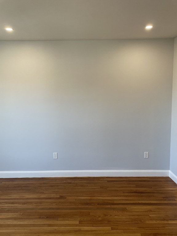 3 Alton Place, Unit 2 Brookline, MA 02446 - Photo 23 of 42 a view of a room with wooden floor