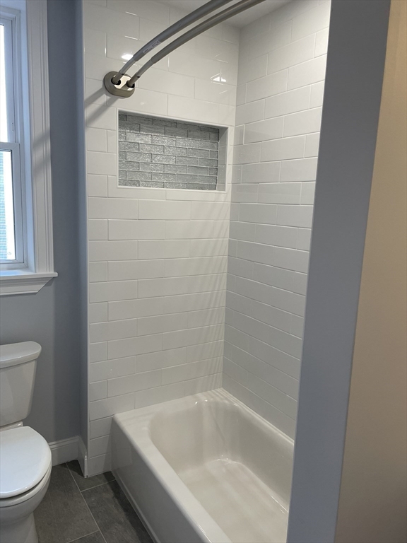 3 Alton Place, Unit 2 Brookline, MA 02446 - Photo 30 of 42 a white toilet sitting next to a bath tub