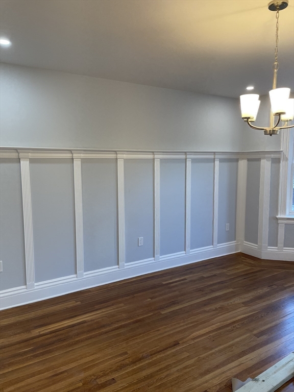 3 Alton Place, Unit 2 Brookline, MA 02446 - Photo 34 of 42 a view of an empty room with wooden floor
