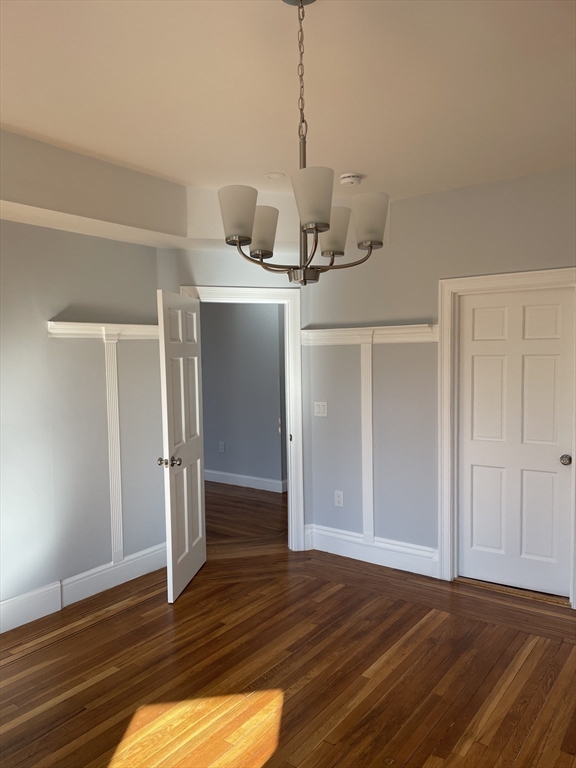 3 Alton Place, Unit 2 Brookline, MA 02446 - Photo 35 of 42 a view of a room with wooden floor