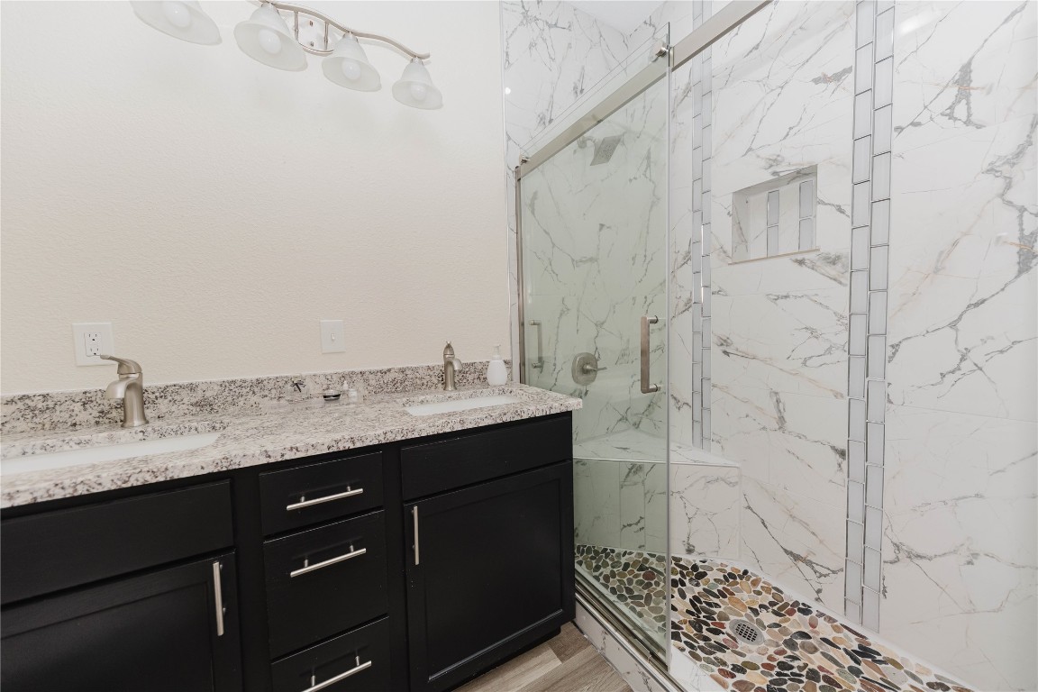 107 Silver Fox Waco, TX 76705 - Photo 16 of 33 a bathroom with a granite countertop sink and a mirror