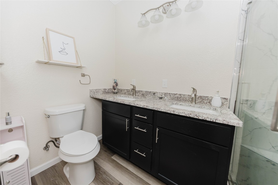 107 Silver Fox Waco, TX 76705 - Photo 17 of 33 a bathroom with a granite countertop toilet sink and mirror