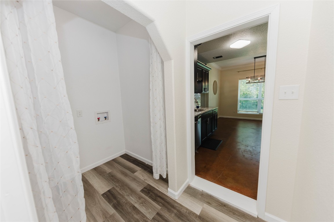 107 Silver Fox Waco, TX 76705 - Photo 20 of 33 a view of a hallway with wooden floor and a bathroom