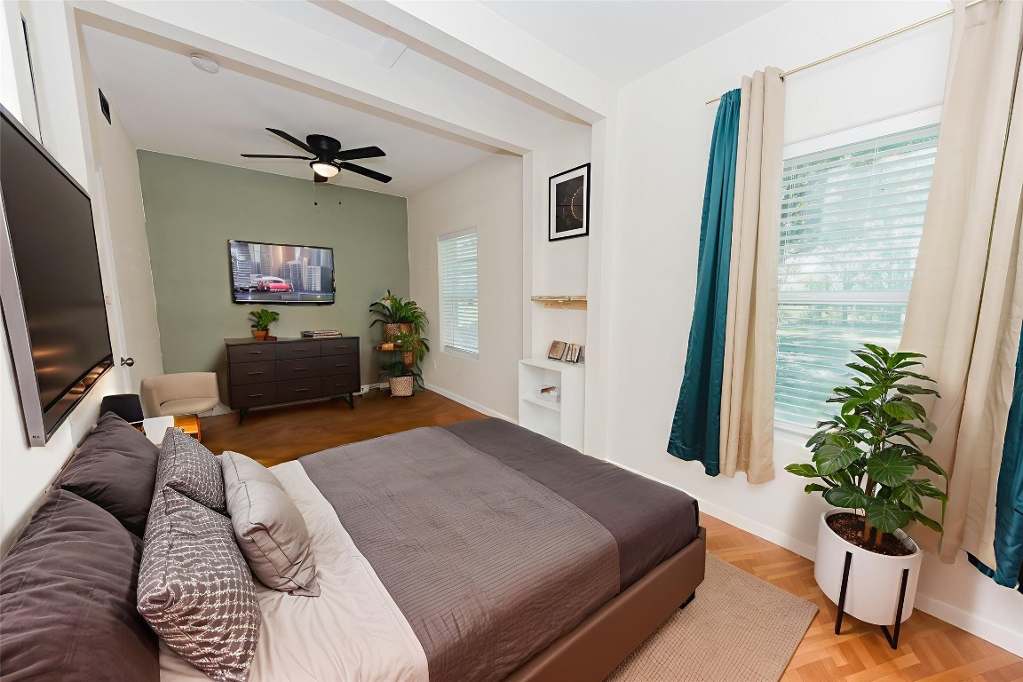 107 Silver Fox Waco, TX 76705 - Photo 23 of 33 a bedroom with a bed and a potted plant