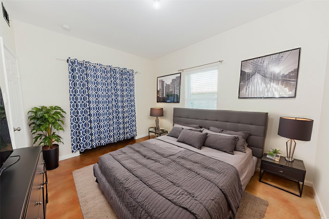 107 Silver Fox Waco, TX 76705 - Photo 29 of 33 a bedroom with a bed and a painting on the wall